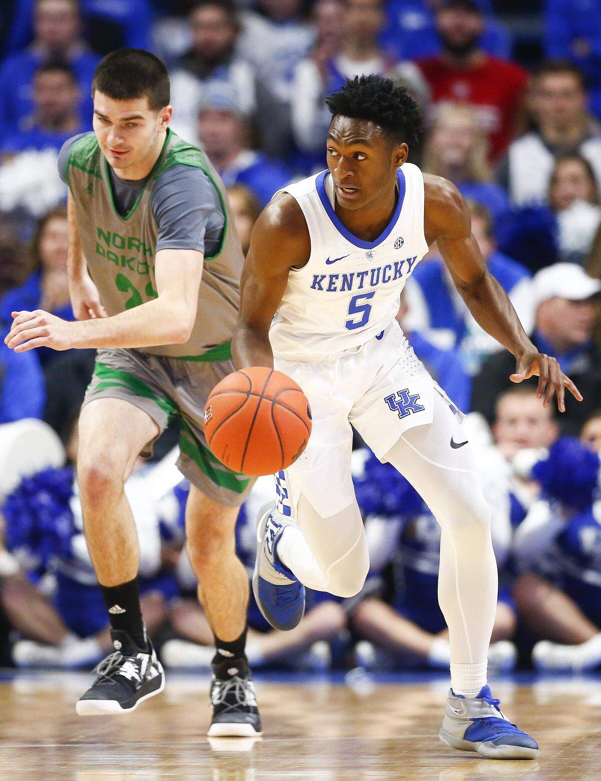 Kentucky guard Immanuel Quickley (5) drove the ball up court in front of North Dakota forward Walter Kienan during Kentucky’s win in Rupp Arena on Wednesday night.