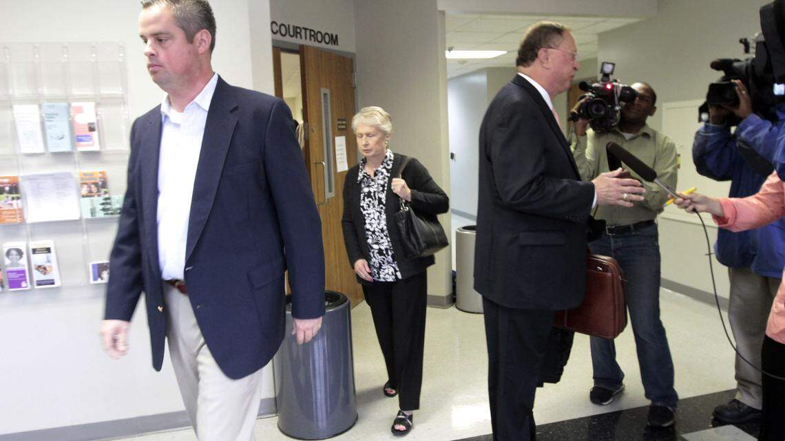 Jason Carpenter headed for the elevator as his attorney, Warren Scoville, spoke briefly to the media after Carpenter's arraignment Tuesday in Scott County on sex abuse and child-porn charges. Scoville told reporters that it was too early in the case to comment.  