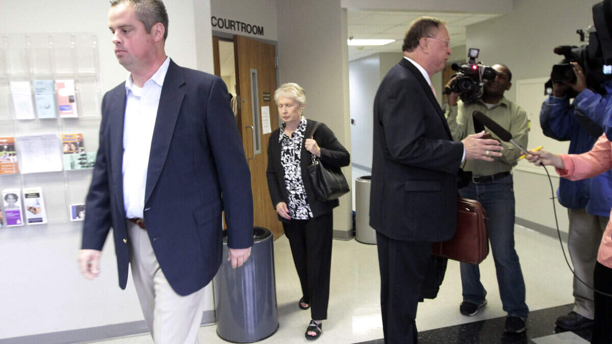 Jason Carpenter headed for the elevator as his attorney, Warren Scoville, spoke briefly to the media after Carpenter's arraignment Tuesday in Scott County on sex abuse and child-porn charges. Scoville told reporters that it was too early in the case to comment.  