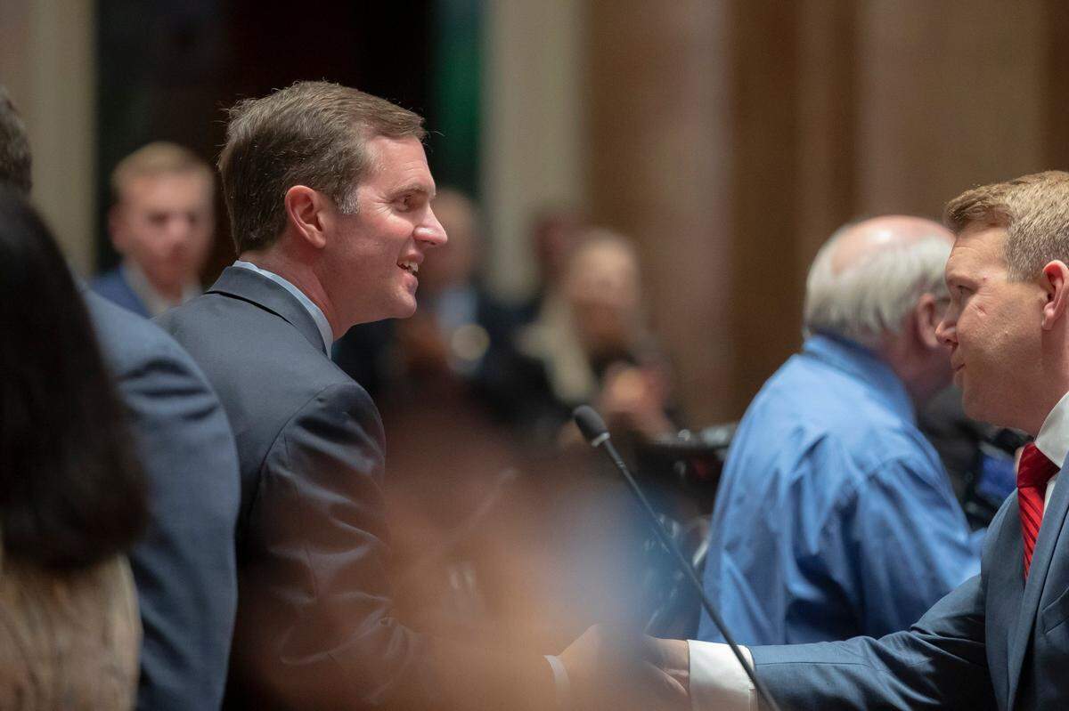 Kentucky Gov Andy Beshear greets state lawmakers before he delivers his State of the Commonwealth Address at the Kentucky state Capitol in Frankfort, Ky., on Wednesday, Jan. 4, 2023.