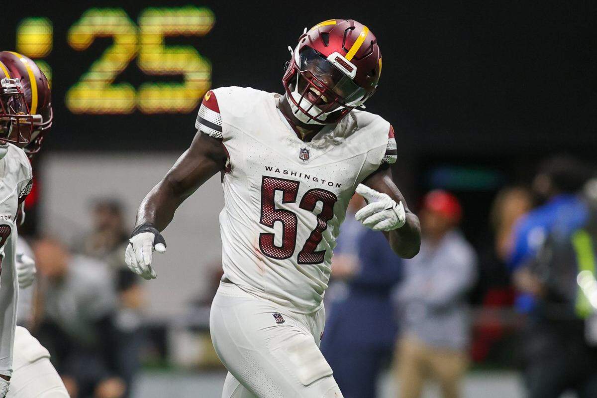 Washington Commanders linebacker Jamin Davis reacts after making an interception against the Atlanta Falcons on Oct. 15.