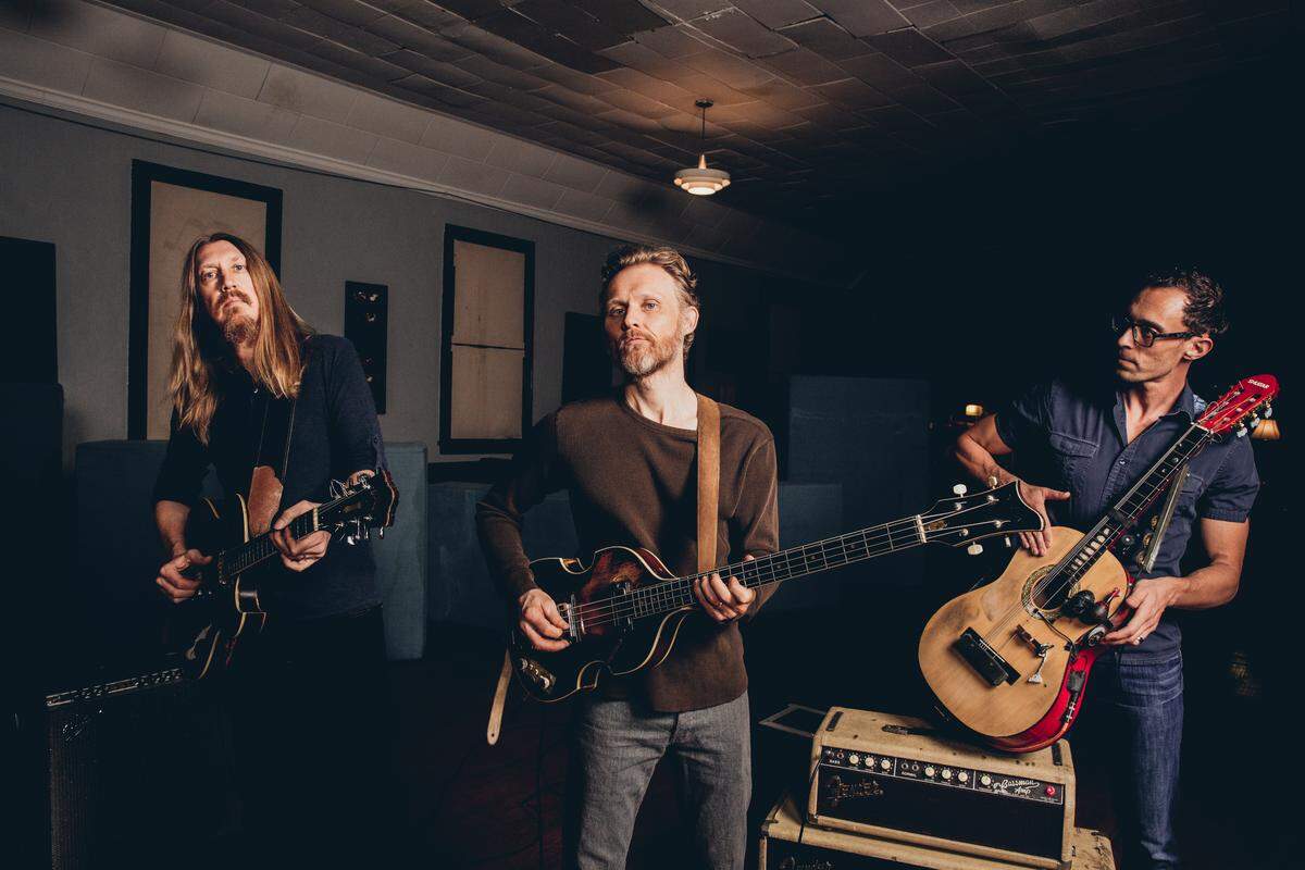 Oliver Wood, Chris Wood and Jano Rix are The Wood Brothers.