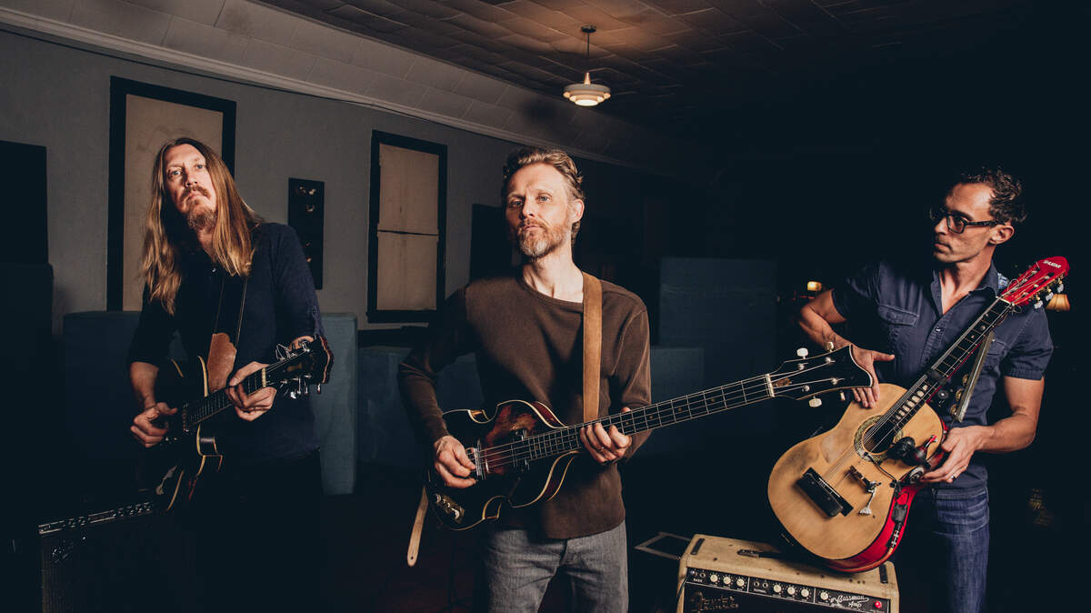 Oliver Wood, Chris Wood and Jano Rix are The Wood Brothers.
