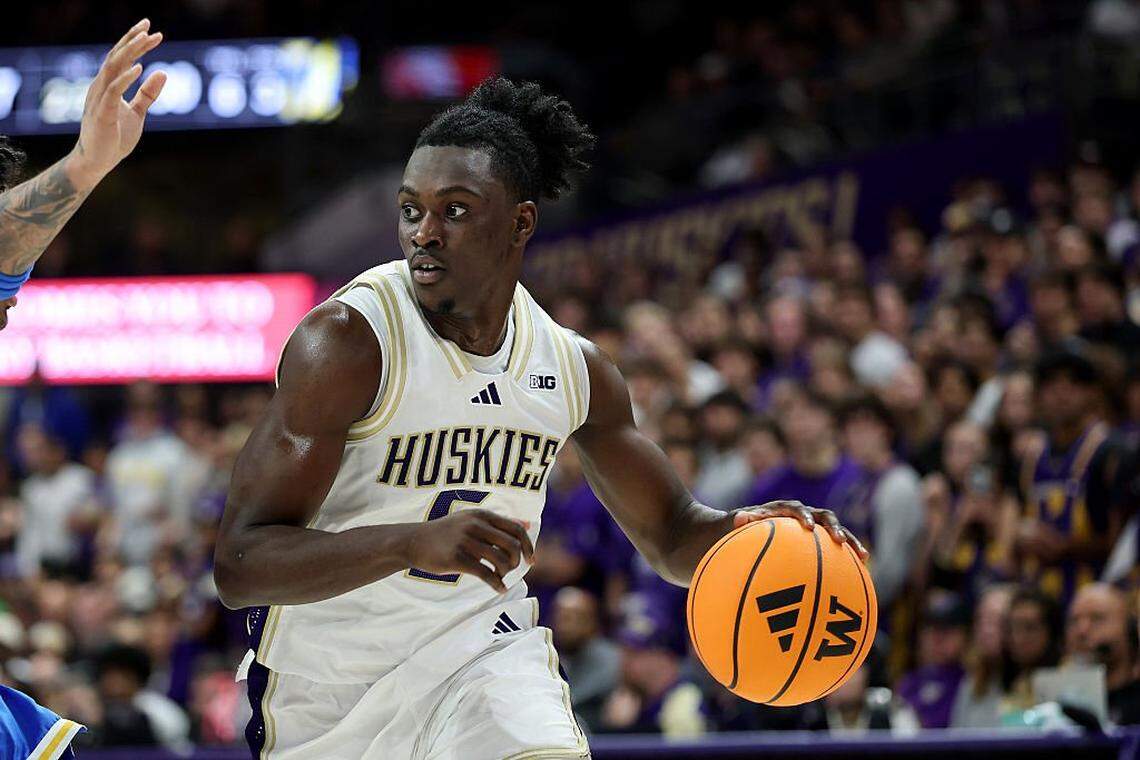 SEATTLE, WASHINGTON - DECEMBER 03: Zoom Diallo #5 of the Washington Huskies dribbles against the UCLA Bruins at Alaska Airlines Arena on December 03, 2025 in Seattle, Washington. (Photo by Steph Chambers/Getty Images)