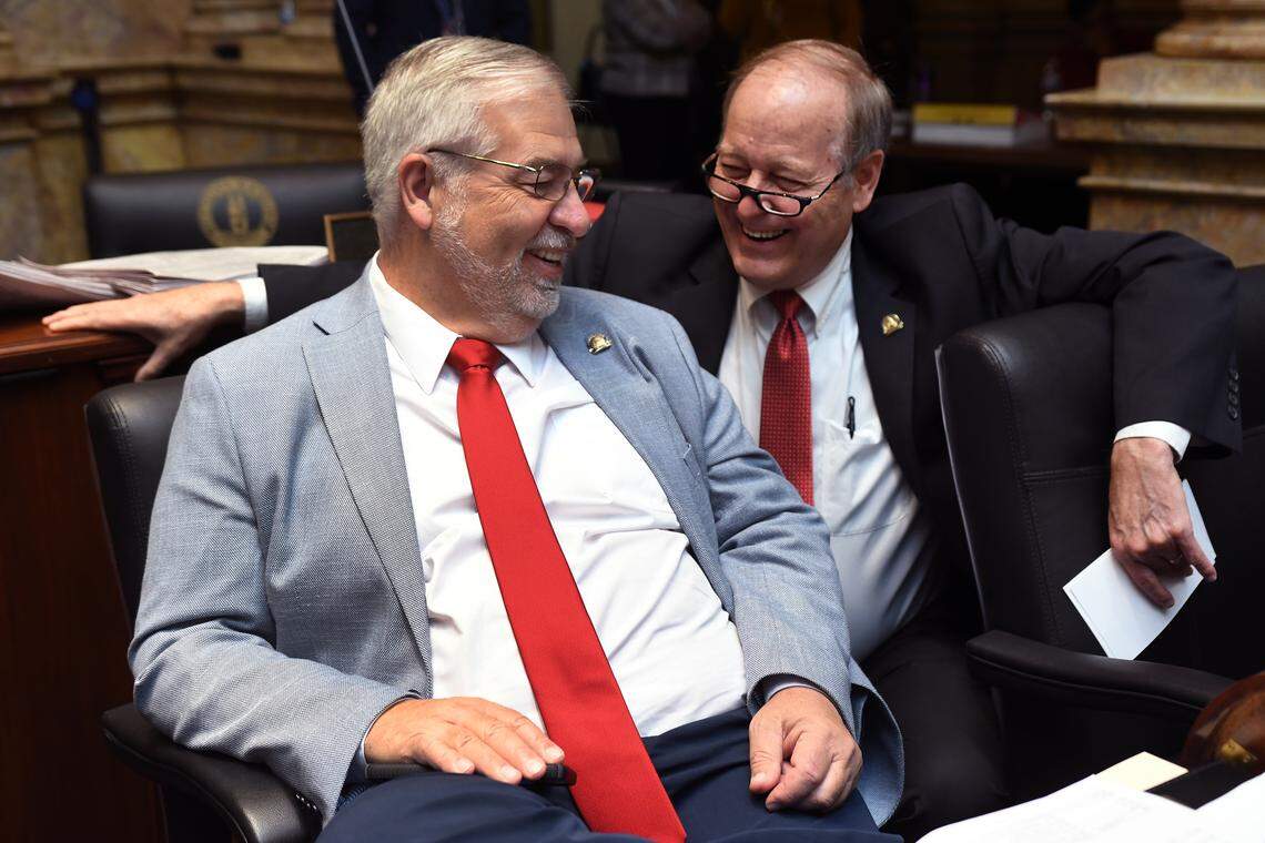 Sen. Greg Elkins, R-Winchester, shares a light moment with Sen. Gex Williams, R-Verona, during a recess on the Senate floor in 2024.