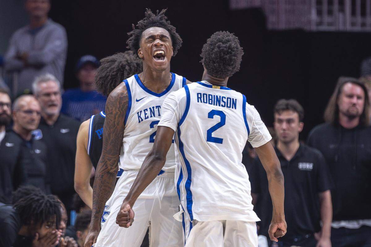 Kentucky center Amari Williams and Wildcats guard Jaxson Robinson celebrate after a big play against the Duke Blue Devils last week.
