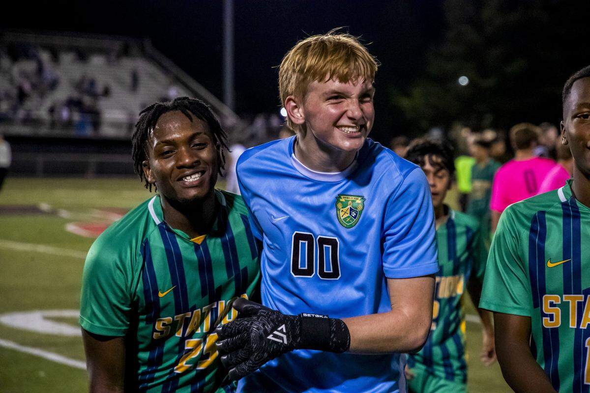 Bryan Station's Luke Majors (0), right, and Bryan Station's Benjamin Mechak (25) celebrate after the Defenders beat Lexington Catholic, 2-0, during the 11th Region semifinals, Wednesday, Oct. 15, 2025 at Paul Laurence Dunbar High School in Lexington, Ky.