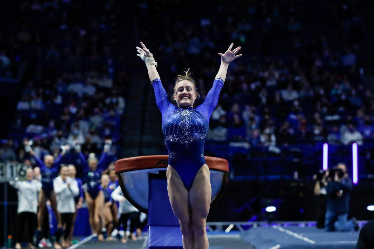 Raena Worley poses after finishing a turn on the vault during Kentucky’s season-opening Excite Night meet in Rupp Arena. Worley was named all-around champion of the meet.