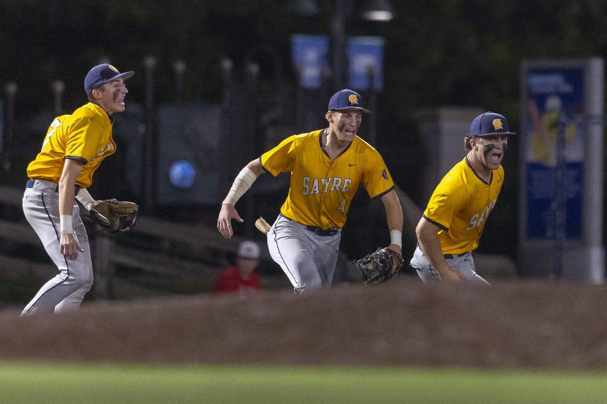 Sayre’s Grady Lamonica (17) from left, Banks Heinrich (4) and Gibson Gary (5) celebrate Gibson stepped on third base to complete a game-ending double play in the Spartans’ 5-4 win over Madison Central in the 11th Region Baseball Tournament semifinals at Legends Field on Wednesday.