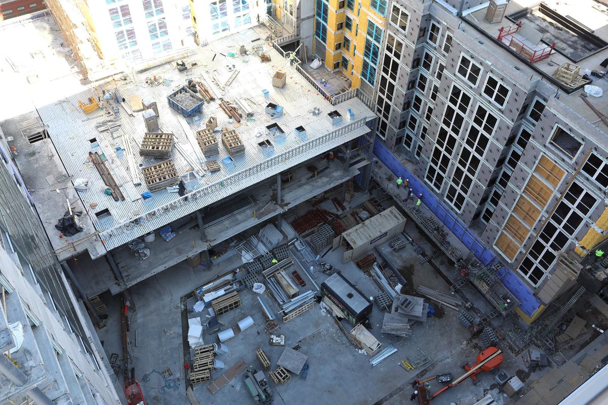 The rooftop pool of the Residence Inn can be seen, top right, as construction continued on the hotels and courtyard Wednesday at City Center in Lexington.