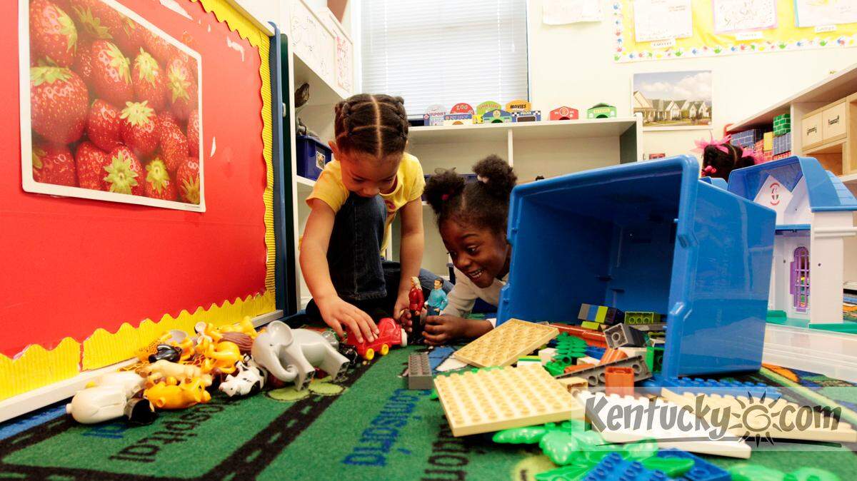 Lyric Thompson, 5, left, and Jashari Green, 4, played at the Russell Center in this 2013 file photo. The state cuts in child care assistance subsidies affected preschools like the Community Action Council's Russell Center. Photo by Pablo Alcala | Staff