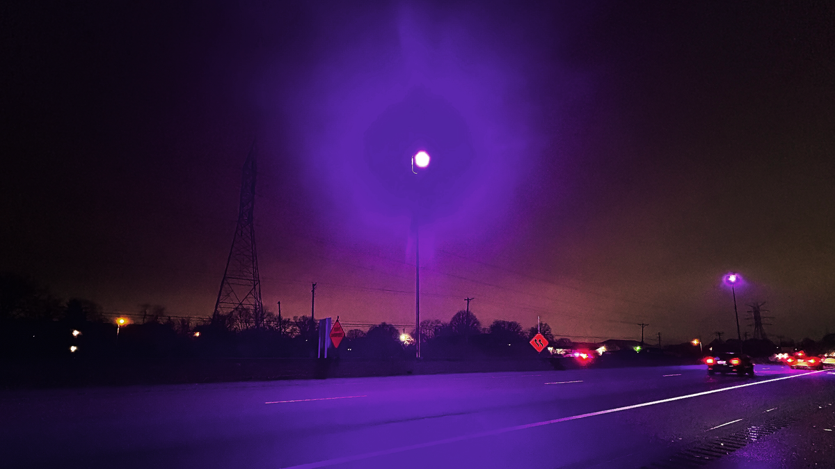 Mysteriously eerie purple street lights glow along New Circle Road, spaced about a mile in each direction of Georgetown Road, illuminating the highway Dec. 10, 2024, in Lexington, Ky.