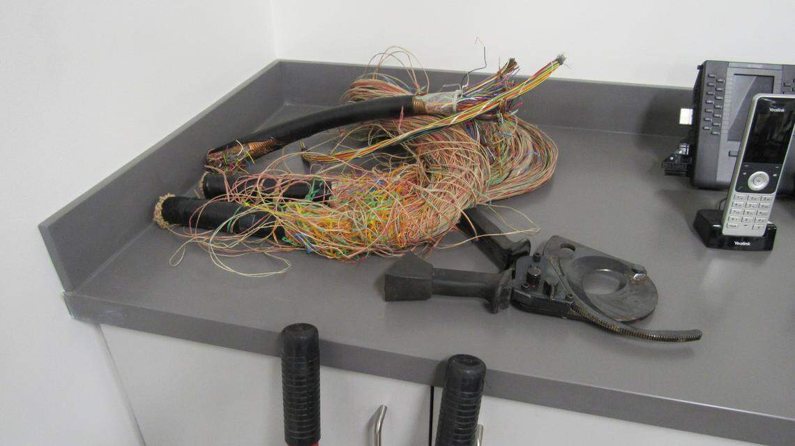 Thefts of copper telecommunication lines have increased in Kentucky. The photo shows an example of the lines with a tool called a ratchet cutter, used to cut lines, at the Kinetic office in Lexington, Ky.