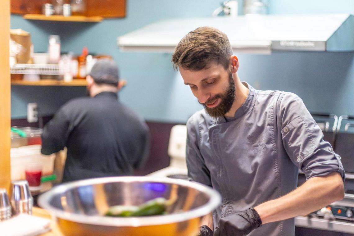 Chef Aaron Craft, Yearling Kitchen co-owner, prepares deviled eggs at the eatery inside Blue Stallion Brewing.