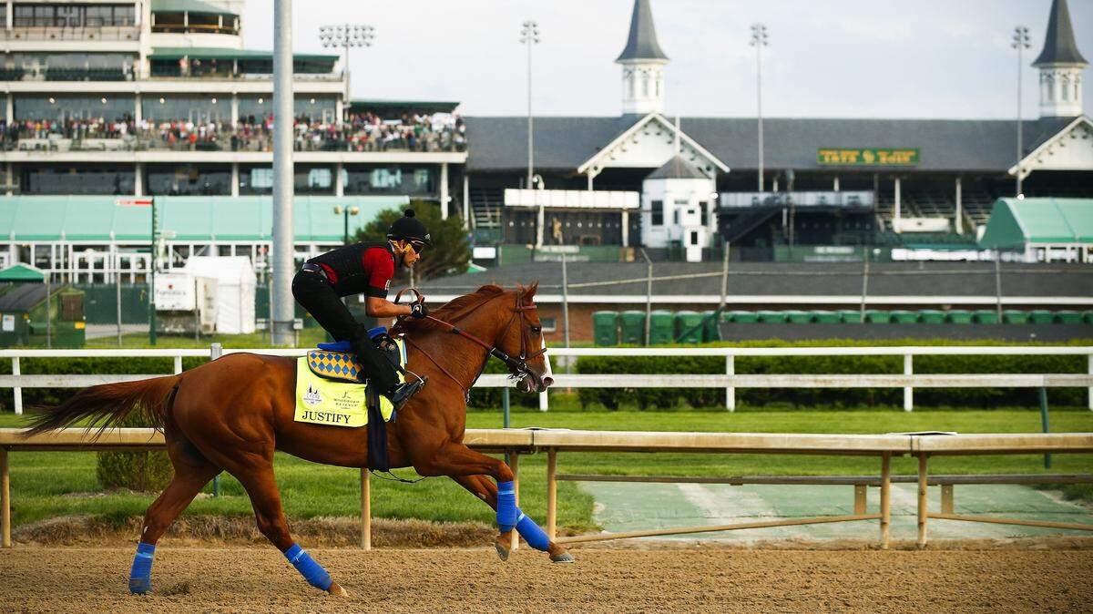 Justify, with exercise rider Beto Gomez up, during a morning training session Wednesday at Churchill Downs. 