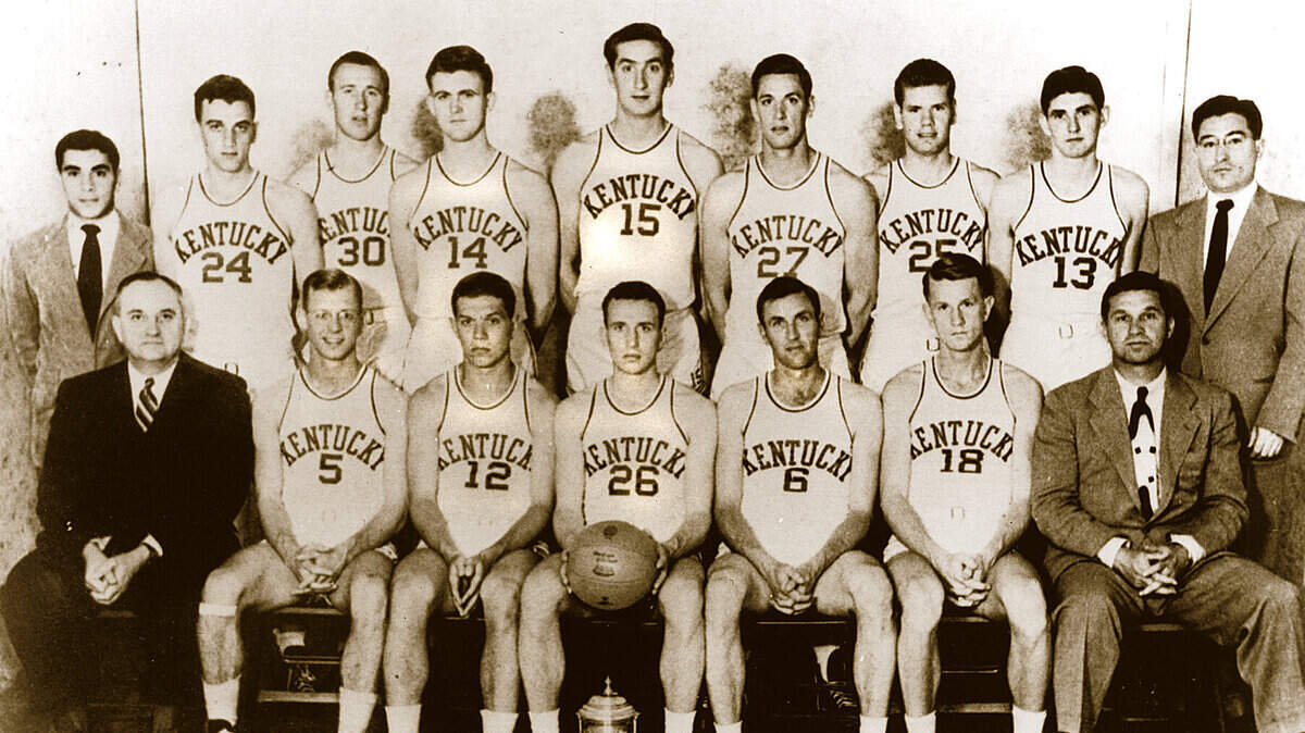 Kentucky's 1948 NCAA championship team. Front row: Coach Adolph Rupp, Johnny Stough, Ralph Beard, Kenneth Rollins, Cliff Barker Jr., Dale Barnstable, assistant coach Harry Lancaster. Second row: Manager Humzey Yessin, Garland Townes, Jim Jordan, Joe Holland, Alex Groza, Wallace Jones, Jim Line, Roger Day, trainer Wilbert Bud Berger. From 1946-47 through 1949-50, UK won 127 games and lost only 13, winning two national championships.   