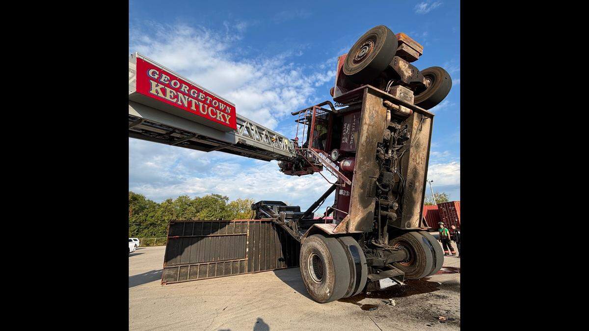 Members of the Georgetown Fire Department rescue a worker trapped on a crane near the Toyota rail yard Wednesday, Sept. 3, 2025.