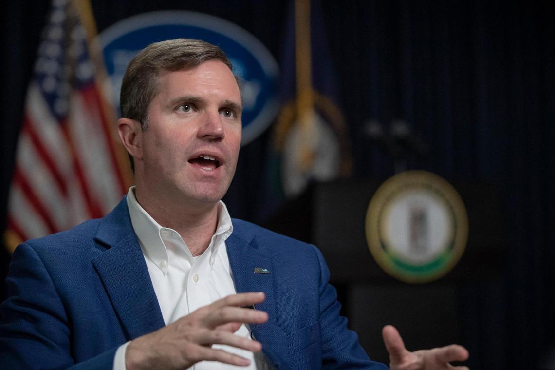 Kentucky Gov. Andy Beshear speaks to a reporter at the state Capitol in Frankfort on Wednesday, Dec. 7, 2022.