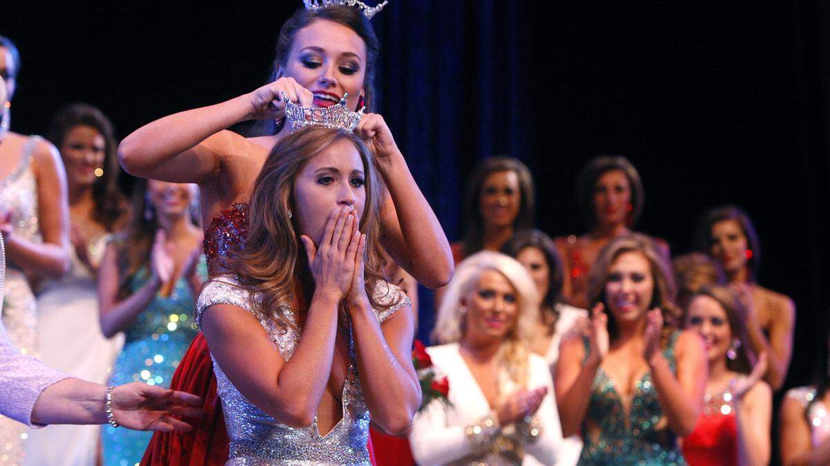 Miss Kentucky 2013 Jenna Day, left, crowns Miss Kentucky 2014 Ramsey Carpenter, Miss My Old Kentucky Home, during the pageant at Singletary Center For the Arts in Lexington, Ky., Saturday, July 12, 2014. Photo by Matt Goins