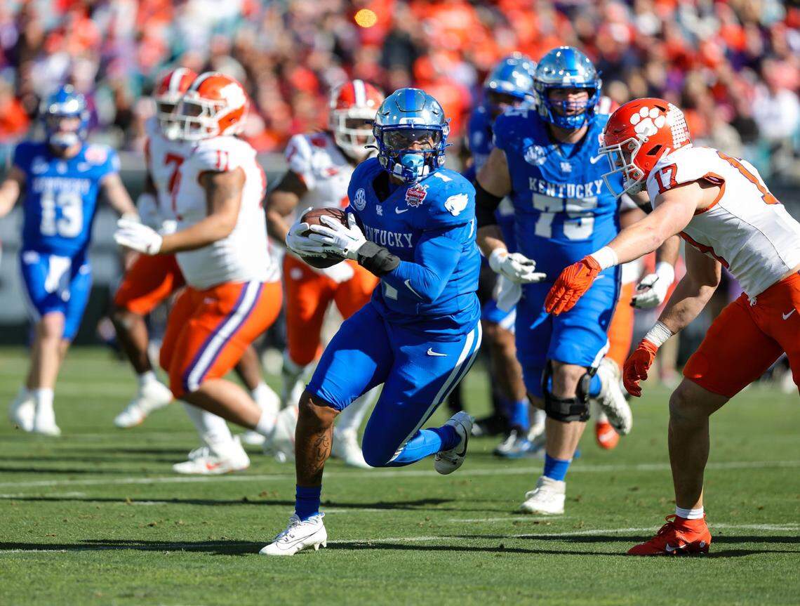 Kentucky’s Ray Davis gains a first down for Kentucky in the Gator Bowl against Clemson on Friday, Dec. 29, 2023.