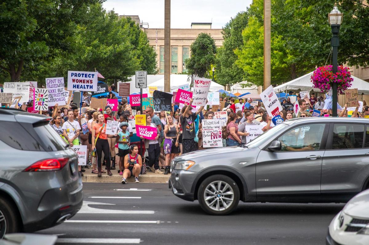 People gather near Robert F. Stephens Courthouse Plaza in downtown Lexington, Ky., on Friday, June 24, 2022 to protest the U.S. Supreme Court’s overturning of Roe v. Wade.