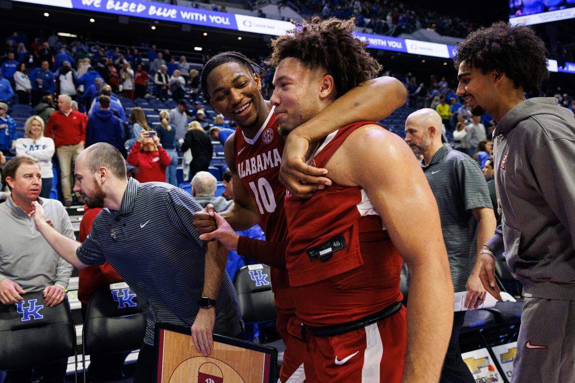 Mouhamed Dioubate hugs Alabama guard Mark Sears as they exit the court after a win over Kentucky in Rupp Arena last season.