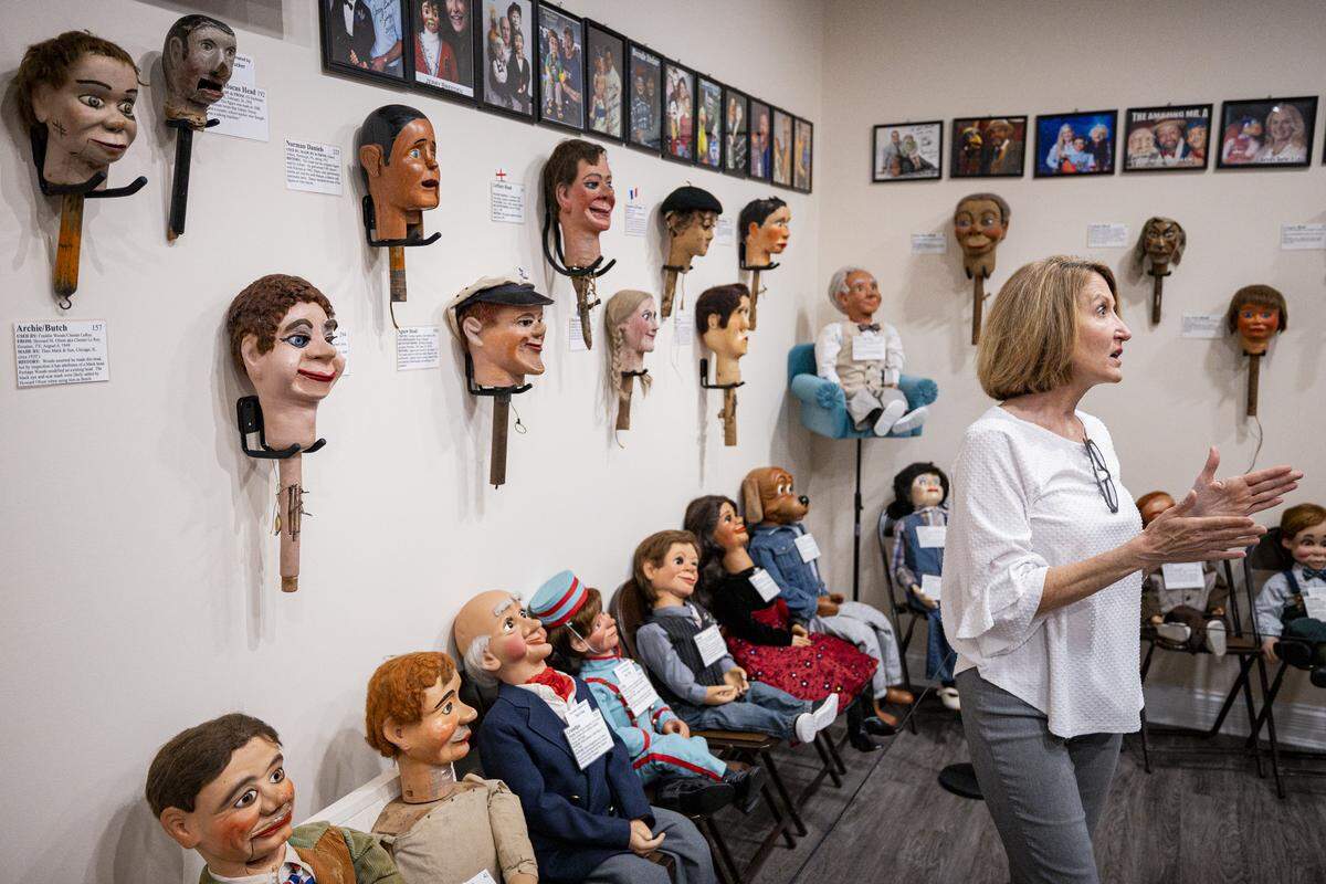 Lisa Sweasy, the museum curator, explains that the head is the main part off a doll during a tour on Tuesday, Aug. 12, 2025, at Vent Haven Museum in Fort Mitchell, Ky. 