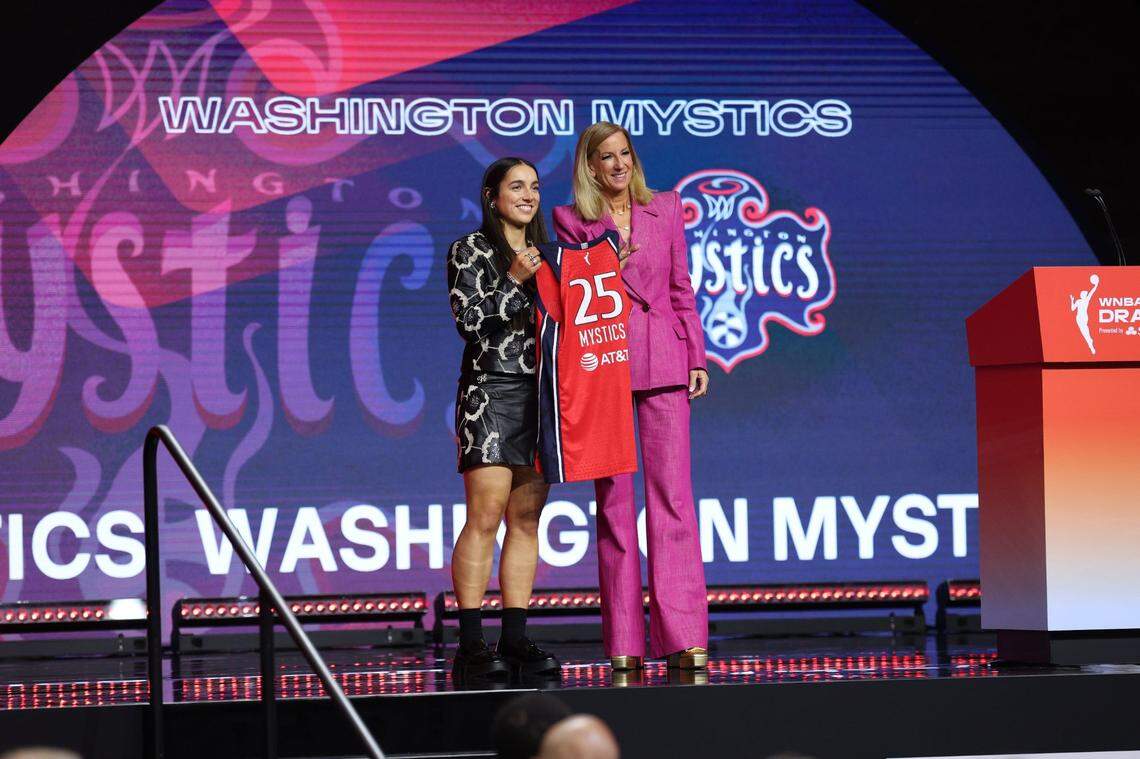 Georgia Amoore poses with WNBA commissioner Cathy Engelbert after being selected sixth overall in Monday’s draft by the Washington Mystics.