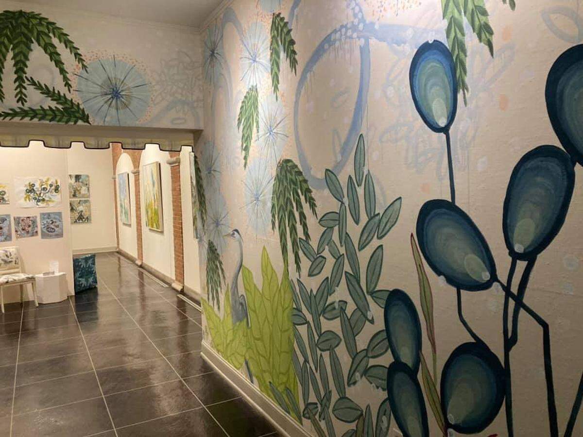 A mural by Versailles artist Alex K. Mason at the entrance of the “Informed by Nature” exhibit at the Headley-Whitney Museum.