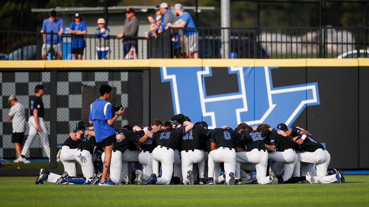 Kentucky huddles in the outfield before a game at Kentucky Proud Park last week.