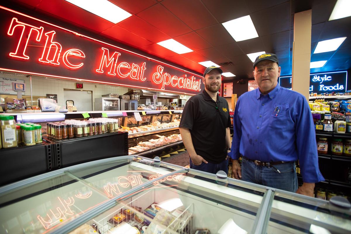 Mike Critchfield, right, handed off his manager position of Critchfield Meats to his nephew, Anthony Critchfield, left, after working 50 years at the business in 2019.