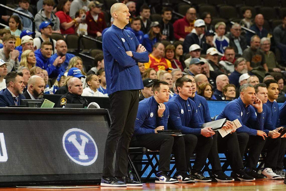 Mar 21, 2024; Omaha, NE, USA; Brigham Young Cougars head coach Mark Pope keeps an eye on the action against the Duquesne Dukes in the first round of the 2024 NCAA Tournament at CHI Health Center Omaha. Mandatory Credit: Dylan Widger-USA TODAY Sports