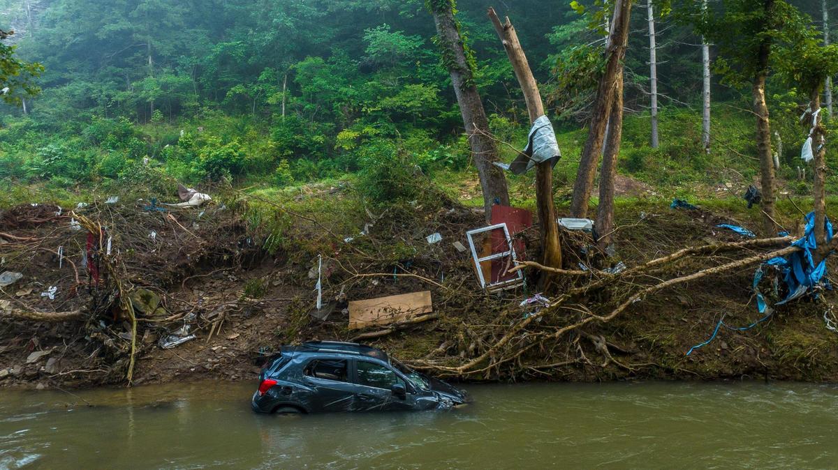 A vehicle is submerged in Troublesome Creek near Dwarf, Ky., on Thursday, Aug. 4, 2022. Flood waters devastated many communities in Eastern Kentucky in July.