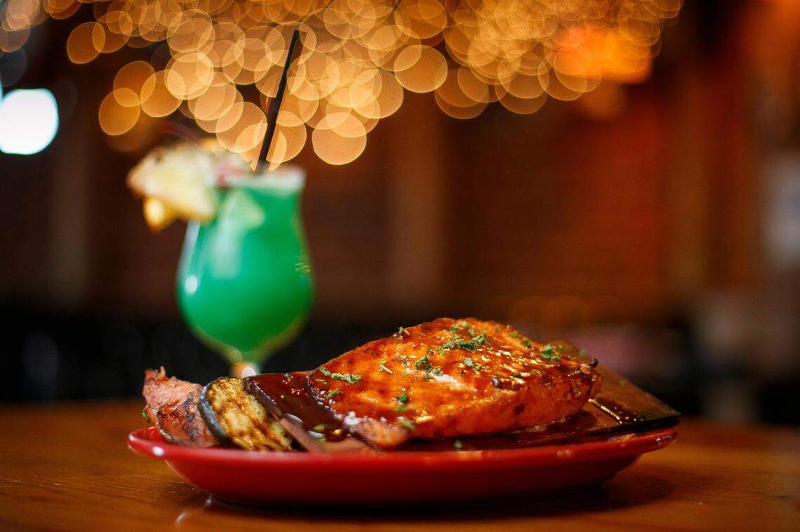 Cedar plank grilled salmon with jerk sauce served with grilled vegetables at The Ketch in Lexington, Ky., Friday, March 12, 2021.