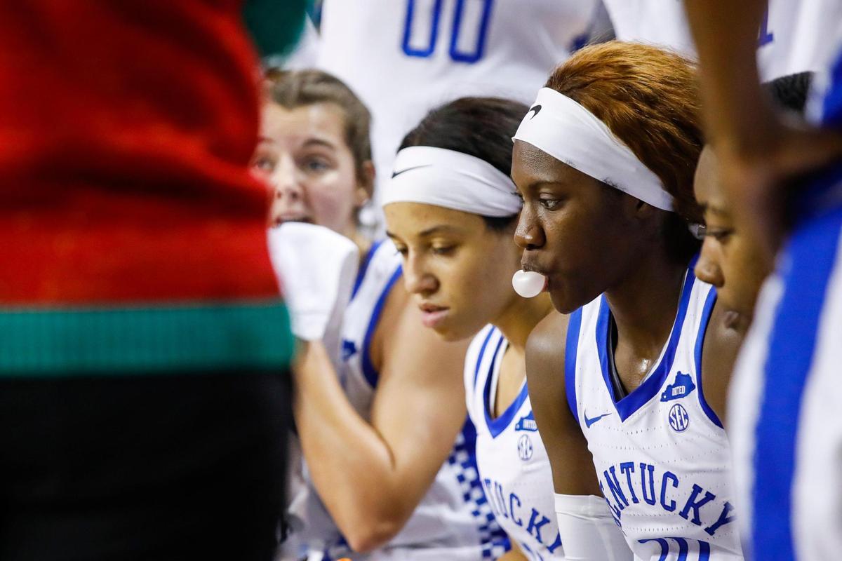 Kentucky Wildcats guard Rhyne Howard (10) blows a bubble on the bench in a timeout during the game against the South Carolina Upstate Spartans at Memorial Coliseum in Lexington, Ky., Sunday, December 19, 2021.