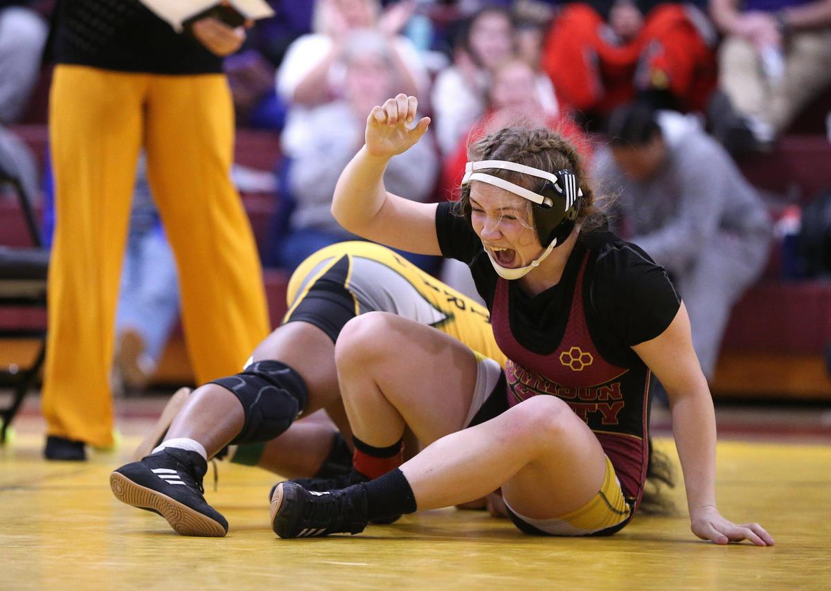 Harrison County’s Rileigh Funkhouser celebrated her victory over Central’s Ronesha Rice in the 126-pound championship match.