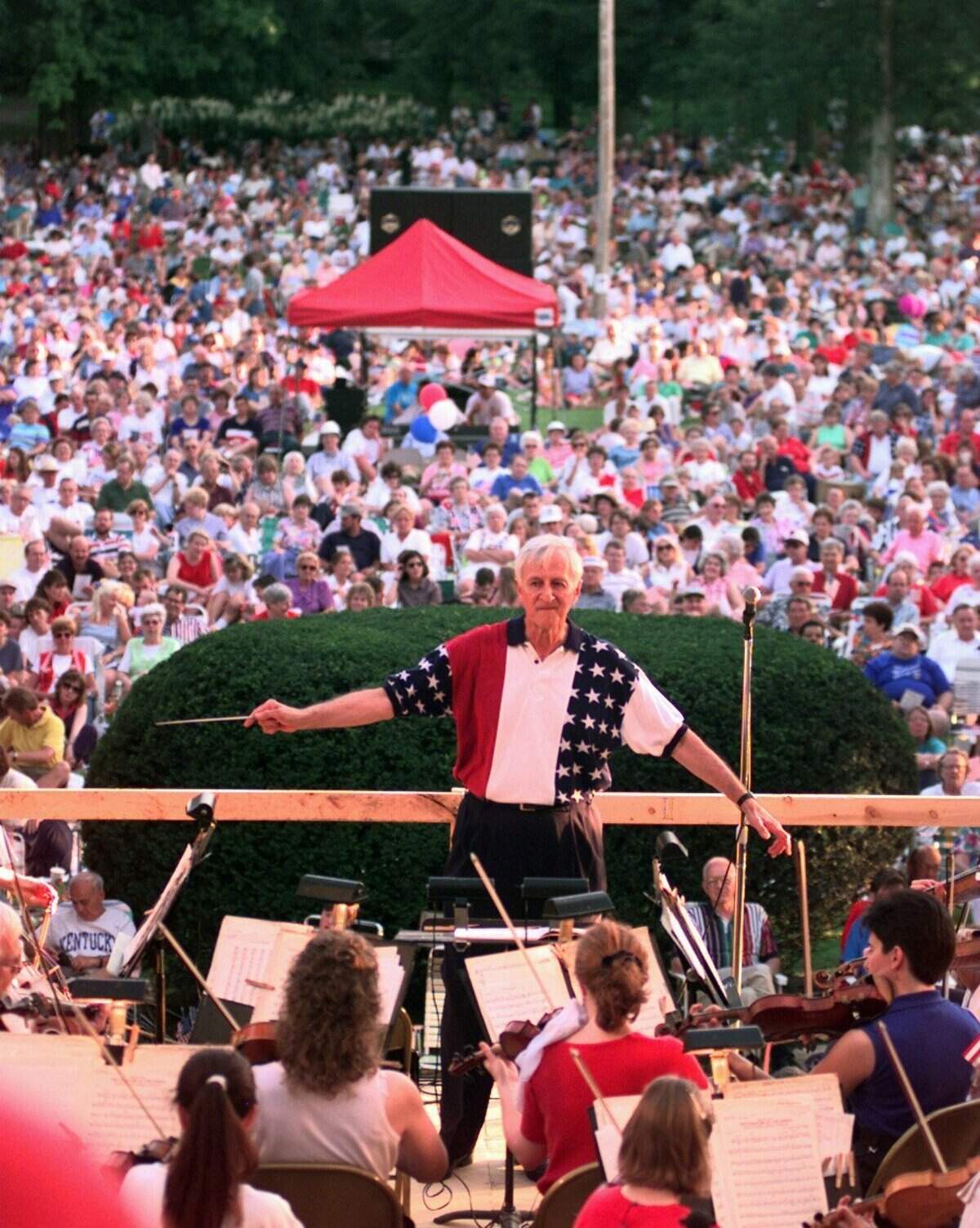 Dr. George Zack led the Lexington Philharmonic Orchestra during the annual patriotic music concert from the stage in front of Old Morrison on the campus of Transylvania University July 4, 1997. Zack, who became the musical director and conductor of the orchestra in 1972, worked with many local music arts groups including the Lexington Singers, Central Kentucky Youth Orchestra, A Kentucky Christmas Chorus and more.