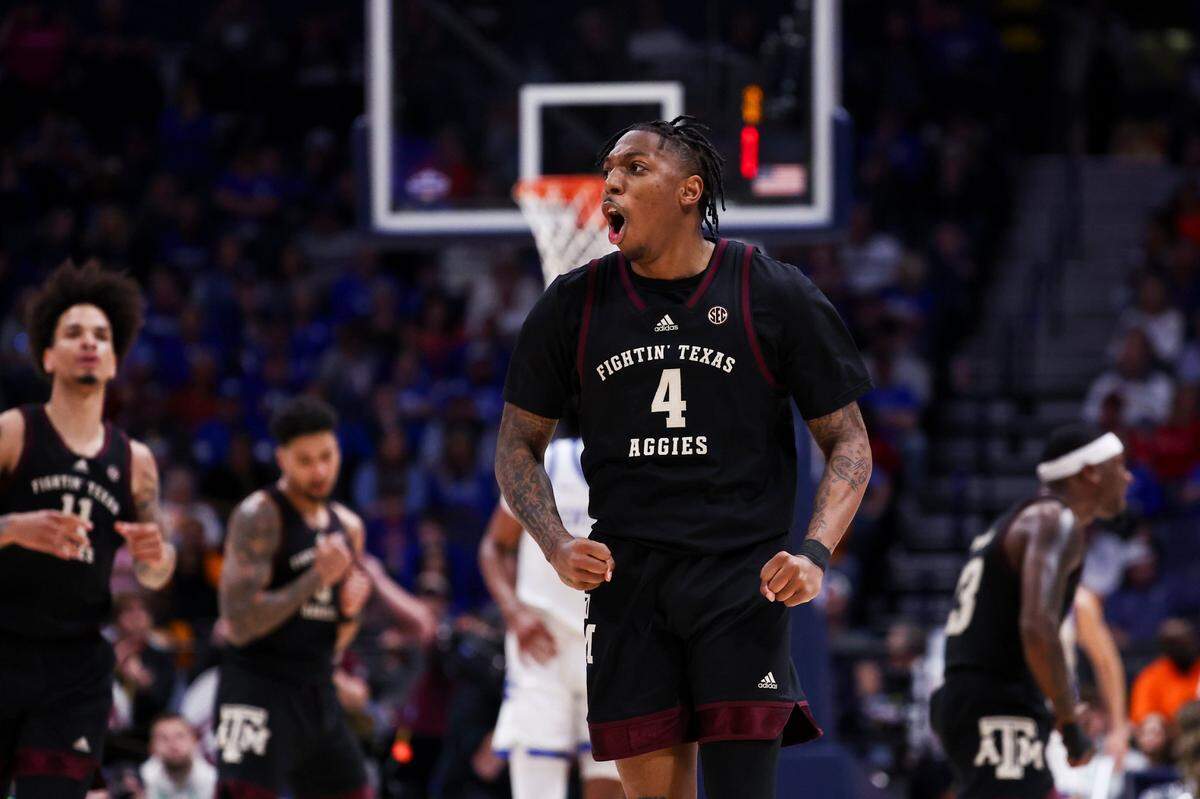 Texas A&M guard Wade Taylor IV (4) celebrates scoring against Kentucky =during the SEC Tournament quarterfinals at Bridgestone Arena in Nashville.