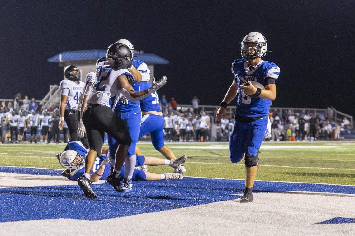 Lexington Christian's Nash Whelan (8) scores a touchdown during an Ecampus.Com Bowl game at LCA in Lexington, Ky., on Friday, Aug. 22, 2025. 