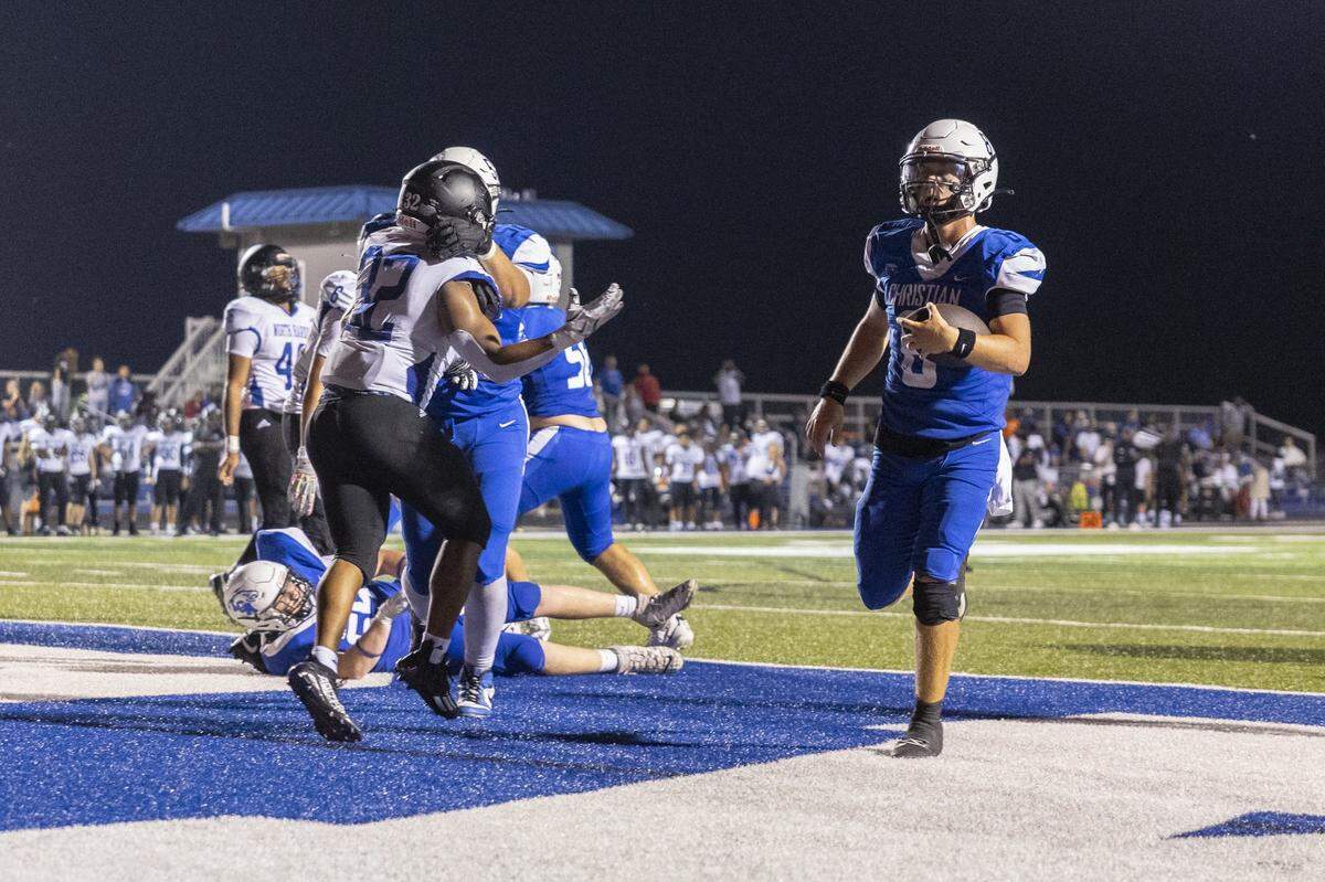 Lexington Christian's Nash Whelan (8) scores a touchdown during an Ecampus.Com Bowl game at LCA in Lexington, Ky., on Friday, Aug. 22, 2025.