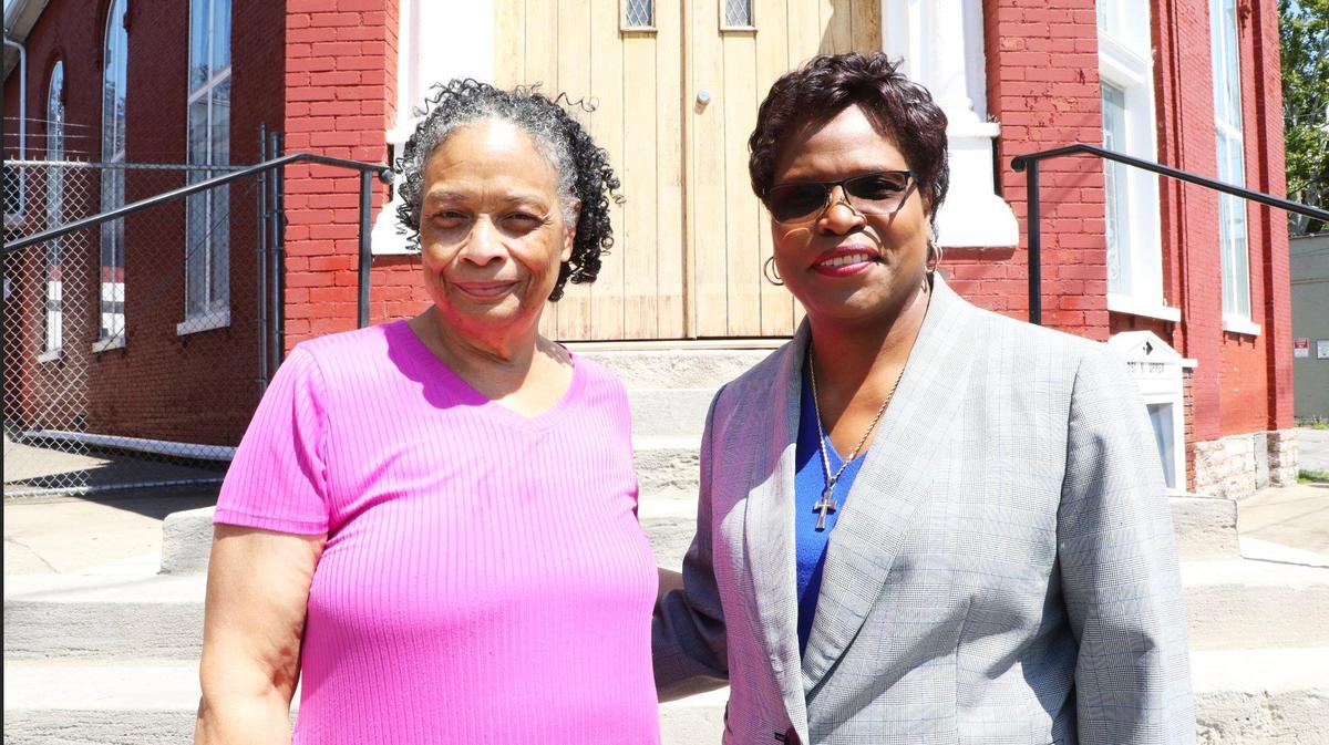 Pastor of Historic St. Paul AME church, Rev. Dr. Stephanie M. Raglin, on the right, stands with church historian, Priscilla Sullivan on the church steps on North Upper St.