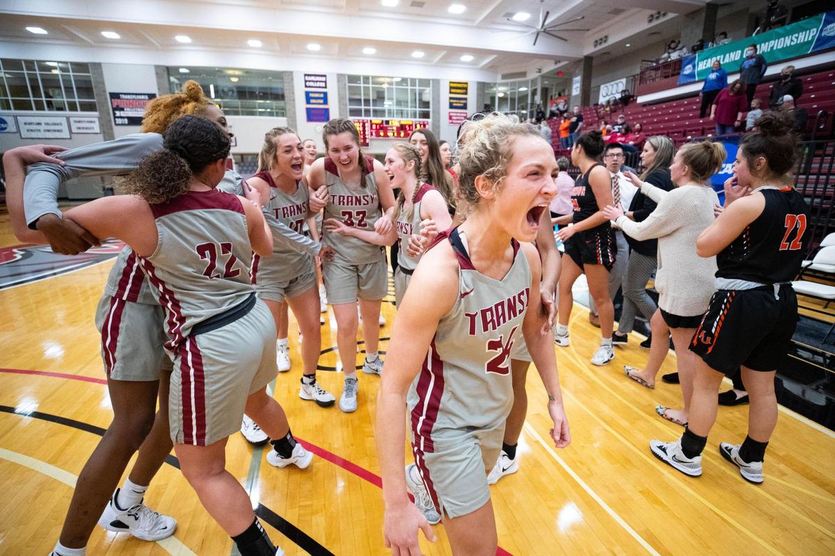 Transylvania players, including Kennedi Stacy (24), celebrate after their 81-51 defeat of Anderson in the Heartland Collegiate Athletic Conference Tournament championship game on Saturday at the Beck Center.