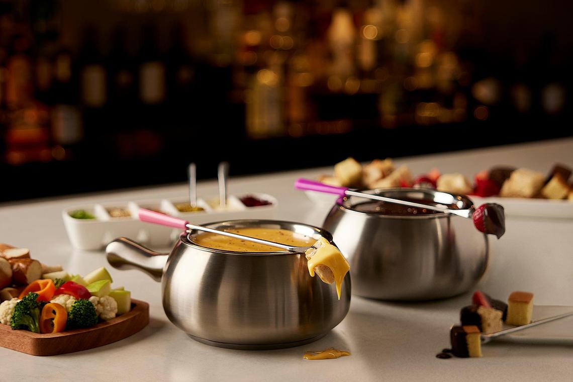 The Melting Pot’s menu is known for its cheese and chocolate fondue. But the chain restaurant also offers more to cook at the table including four-course dinners for two.