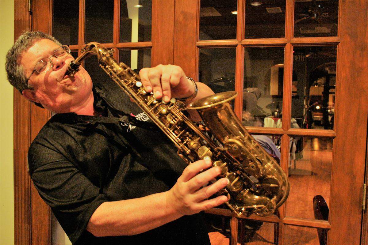 Jazz musician Dave Hall entertains drivers while they wait in the drive-thru window to pick up their orders from Giuseppe’s Ristorante from 5 to 7 p.m. Friday and Saturday nights.