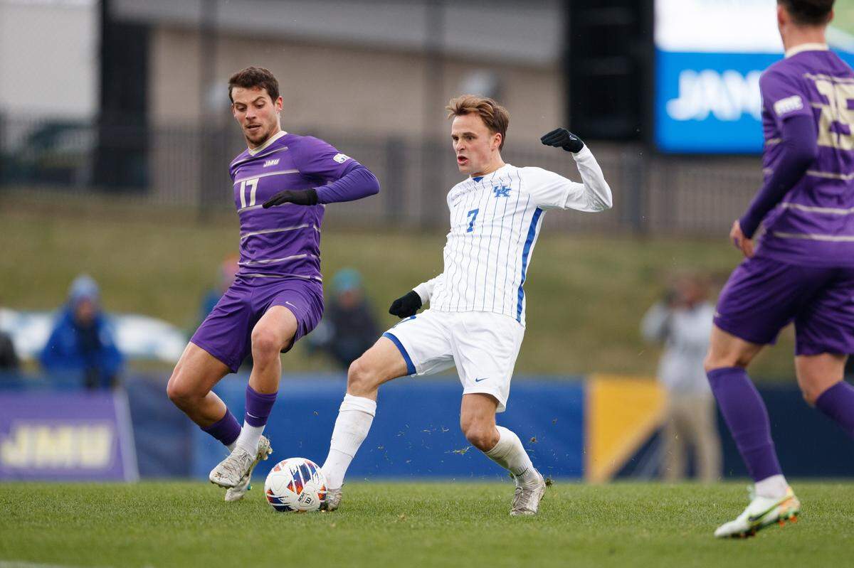 Kentucky’s Nick Gutmann (7) operated between James Madison’s Rodrigo Robles (17) and Chay Strine (25) during Sunday’s 2-0 UK victory.