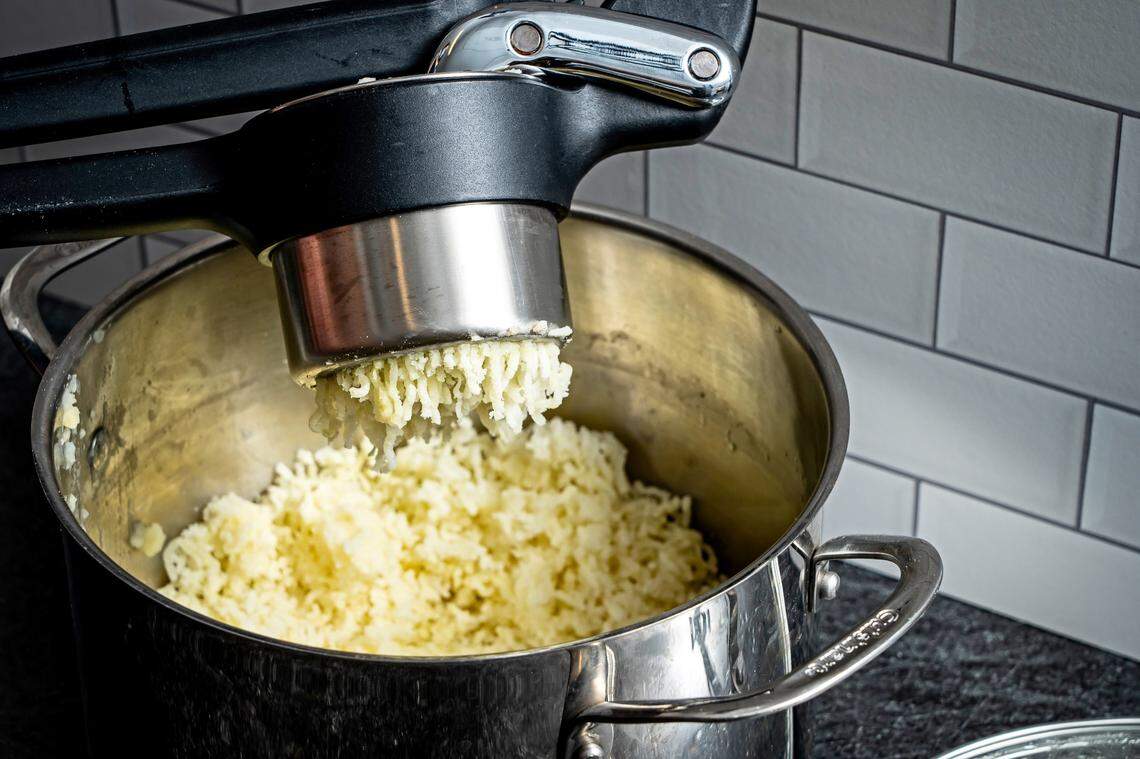 If fluffy is your desired texture, you want to be as gentle as possible with the cooked potatoes, to avoid the release of all that excess starch.