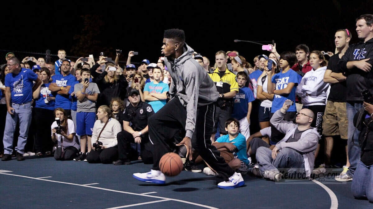 Nerlens Noel played an informal game with Wildcat super fan William Bolden, aka "Stone Cold Willow," on a student court outside Memorial Coliseum. Alex Poythress also played on the student courts for a crowd of fans, most of whom were camping overnight for Big Blue Madness tickets. Photo by Pablo Alcala | Staff
