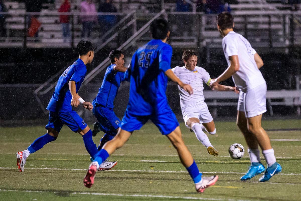Henry Clay’s Marco Messerli (7) looks for an opening during Thursday night’s match. “This program has been through a lot the last couple years,” Messerli said. “So it’s all paying off right now.”