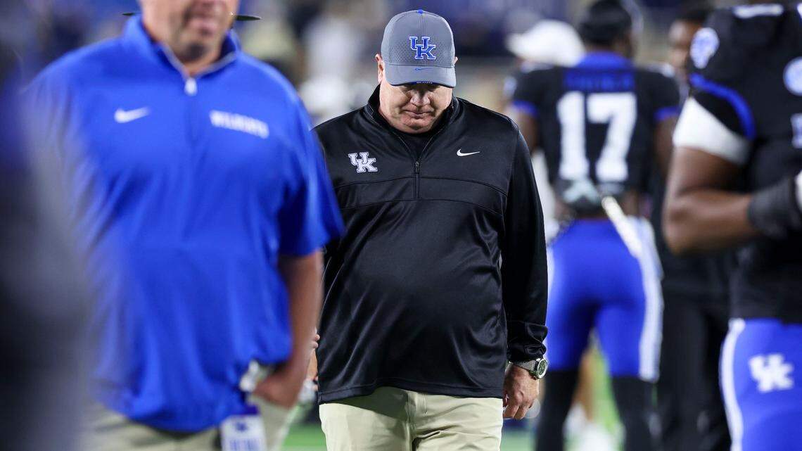 Kentucky head coach Mark Stoops walks off the field after his team lost 20-13 against Vanderbilt on Saturday at Kroger Field.