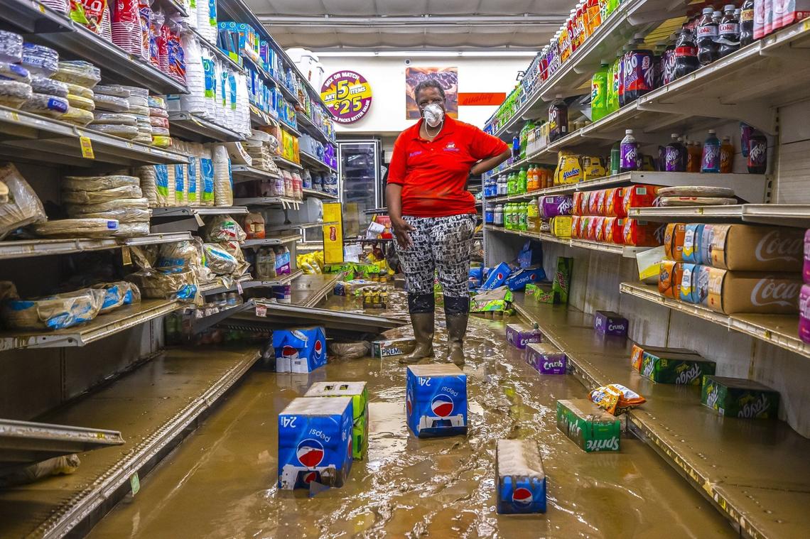 Gwen Christon stands in an aisle at the Isom IGA in Isom, Ky., on Monday, Aug. 1, 2022.